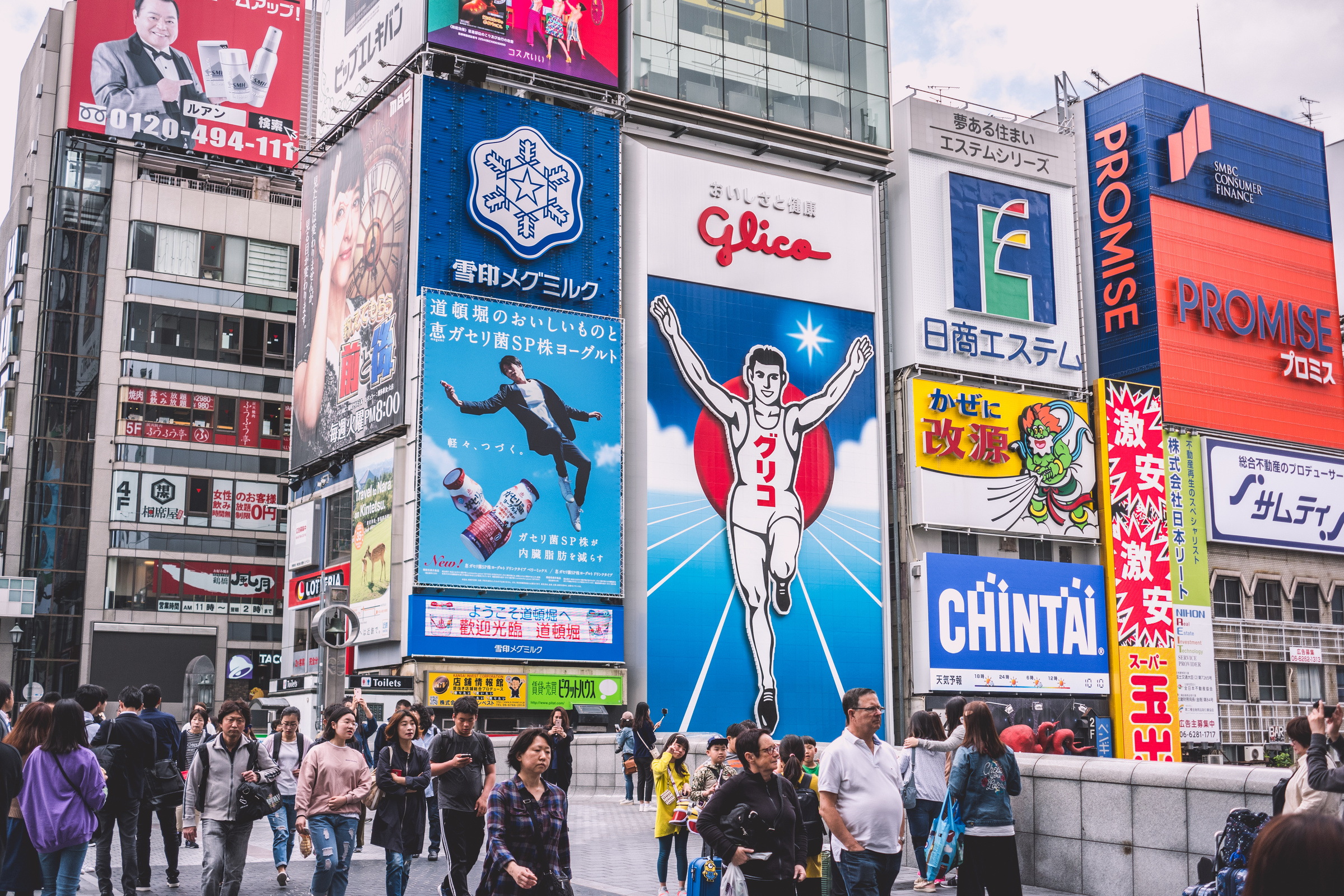 People Walks Near Electronic Billboards